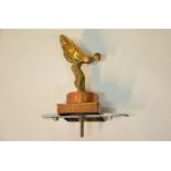  Vintage, solid brass "Flying Lady" hood ornament with copper base and chromed mounting...