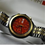  Gold and hardened steel automatic chronograph, manufactured for FERRARI, signed Il cavalino F1. With...