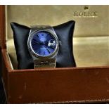  Wristwatch ROLEX Oyster Quartz. Completely made of steel. With calendar. Ø 36mm. Blue dial. With...
