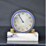 Table clock on marble stand. Enameled lunette. With original suitcase.
