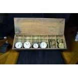 Box with one silver pocket watch and 5 movements