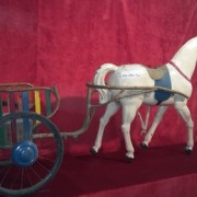 Horse harnessed to a cart
