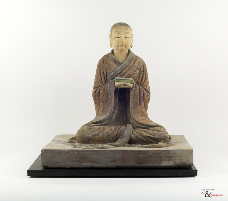 A Painted Clay Ming Dynasty Sculpture of a Luohan, c. 1368-1644