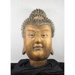 A Gilded and Painted Clay Ming Dynasty Head Of Buddha, c. 1368-1645,