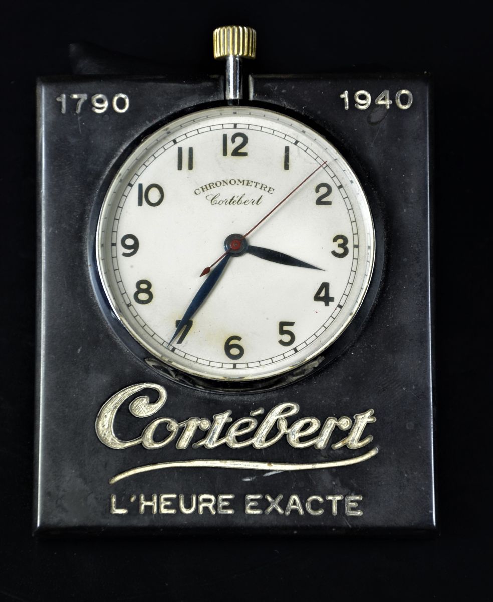 Chronomètre réclame de bureau CORTEBERT avec secondes au centre.