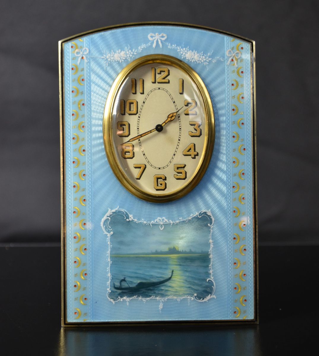 Table clock with 8 day mechanism. Gilded silver and guilloched. VENISE