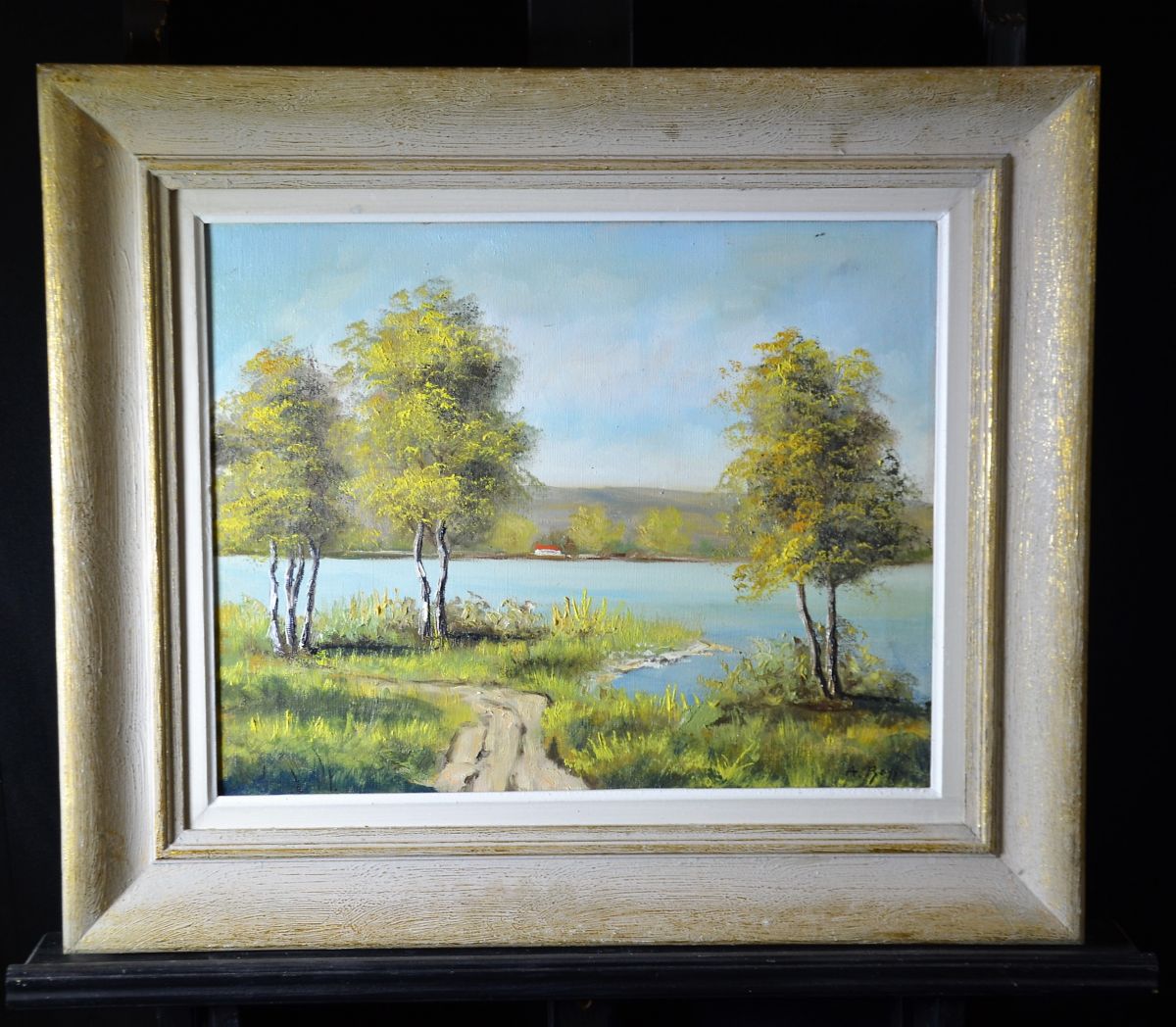 Oil on canvas Landscape of a lake, signed A. Boss. 39 x 49cm.
