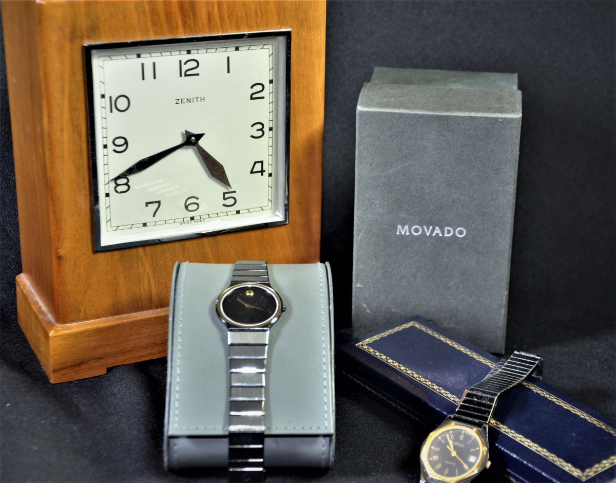  1 montre-bracelet Movado avec box original.1 montre-bracelet Lanco et 1 pendulette-tirelire Zénith...