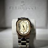 Two-tone wristwatch with diamonds BERTOLUCCI. Nacre clock face with calendar. In box. New old stock.