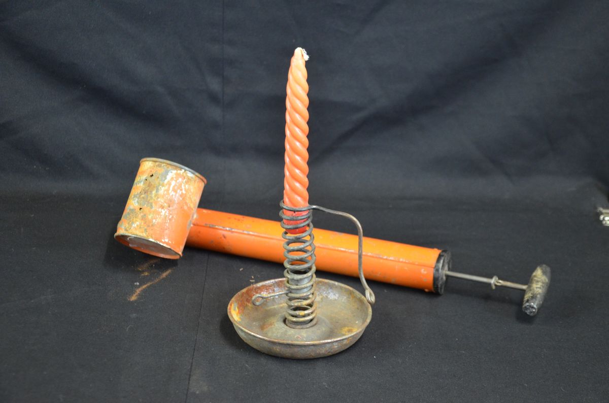  Bundle consisting of height-adjustable candle holder and a poison syringe, both in sheet metal,...