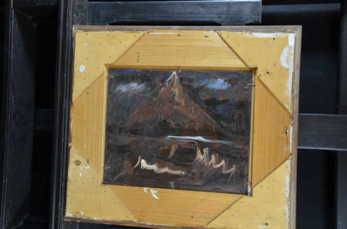 Oil on wood Crucifix in landscape, unreadable signature. 29 x 23cm.