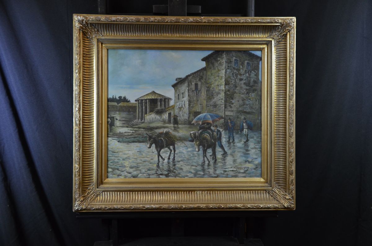  Oil on canvas Street scene with donkeys, signed A. Costantino. Massive wooden gilded frame. 53 x...