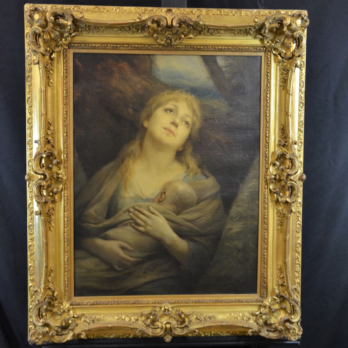  Oil on canvas Breastfeeding mother, signed G. v. Max. Extensive leaf gilded baroque frame with...
