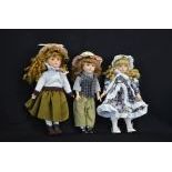  Collection of three dolls with porcelain heads. Collectioners pieces without a neck tag...