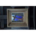 Oil on wood Crucifix in landscape, unreadable signature. 29 x 23cm.