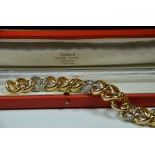 Bracelet à large maillons en or bicolore et diamants 65 g, 20cm.