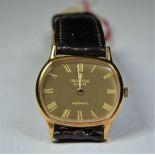  UNIVERSAL  wristwatch. Automatic with micro-rotor. 18ct gold. Box and papers