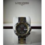  Automatic chronograph LONGINES. With days and dates display. Made of titan and 18ct gold. Ø 40mm....