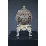 Coconut finely carved on base with silver lid